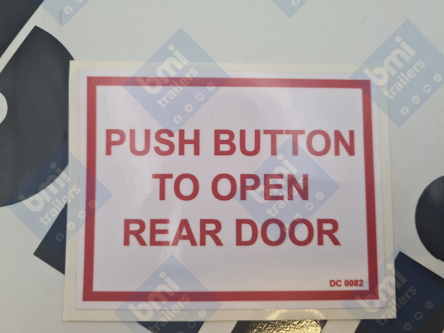 DC 0082 ----- Push Button to open rear door (80w x 100h x 1c) Decal